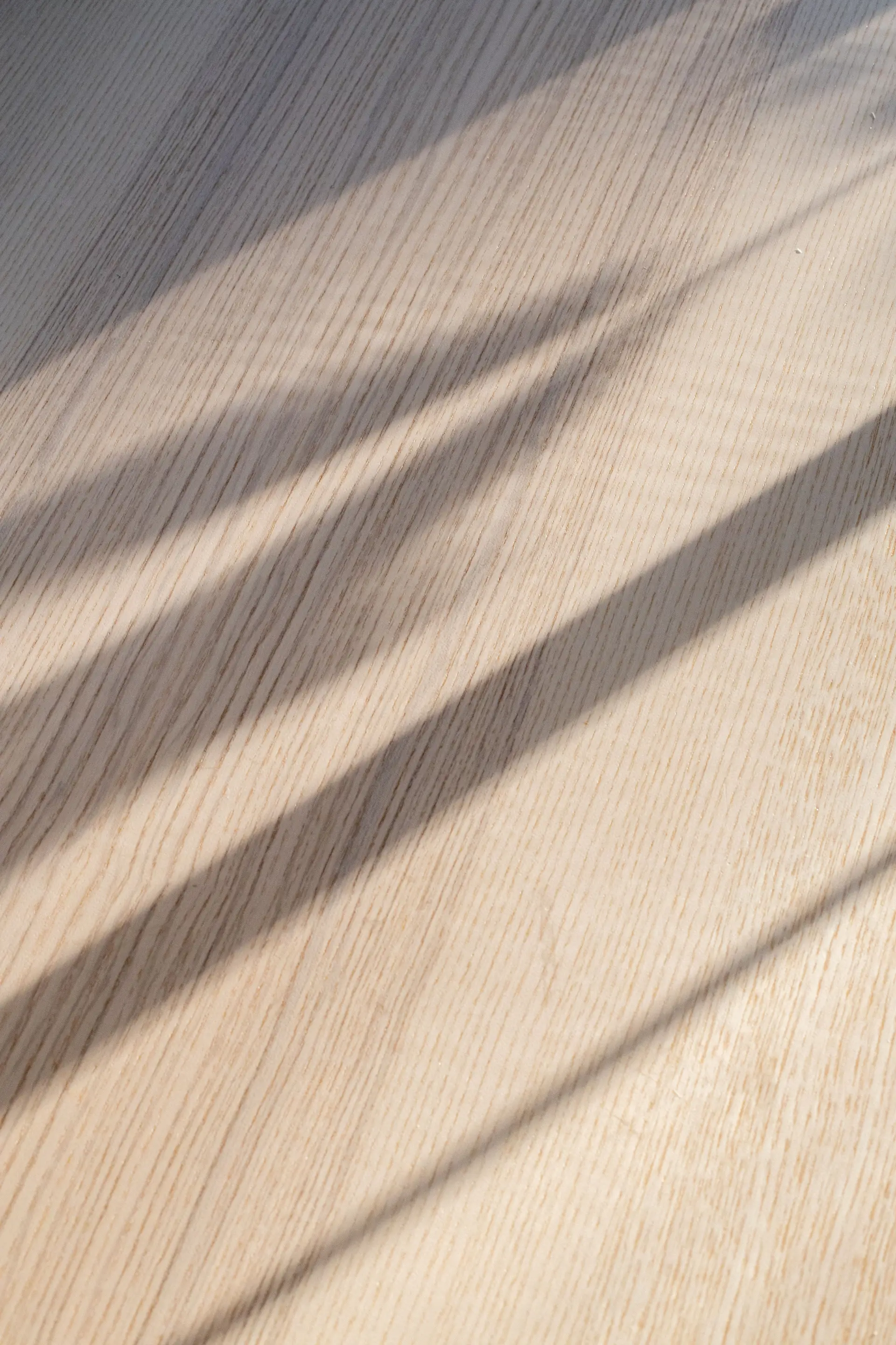 Curtain shadow on a wooden floor